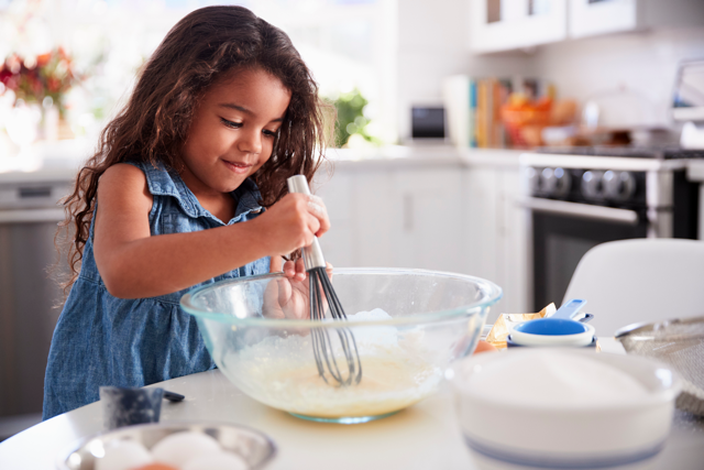 Girl cooking in a kitchen
